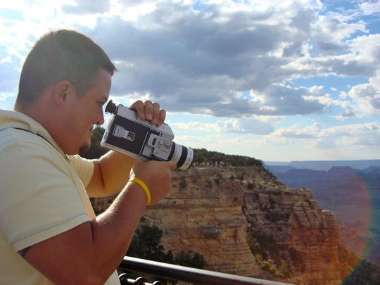 Man holding Pro 8 camera at Grand Canyon