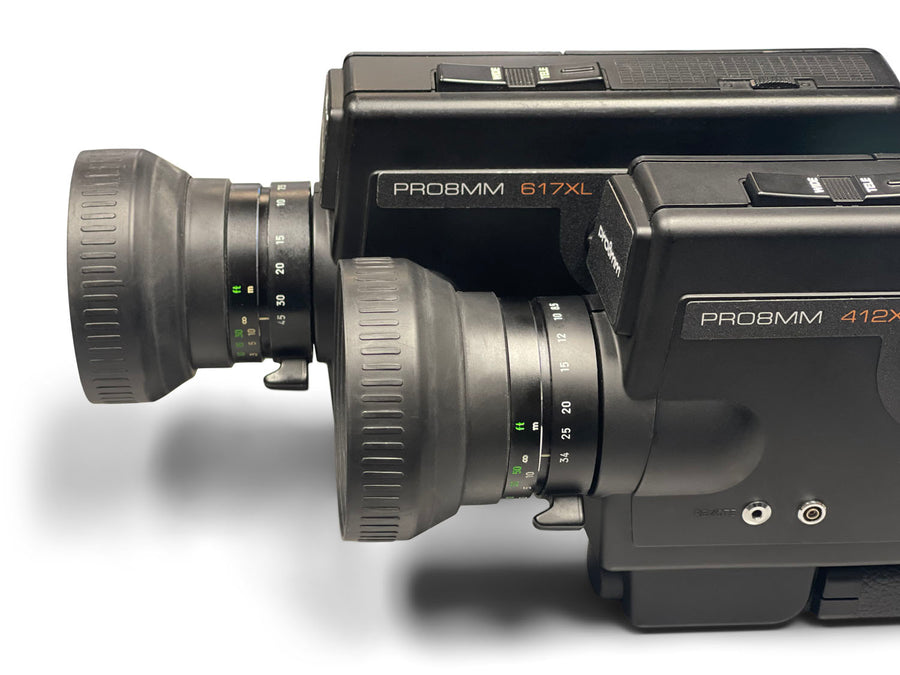 Close-up of 412XL and 617XL video cameras on a white background