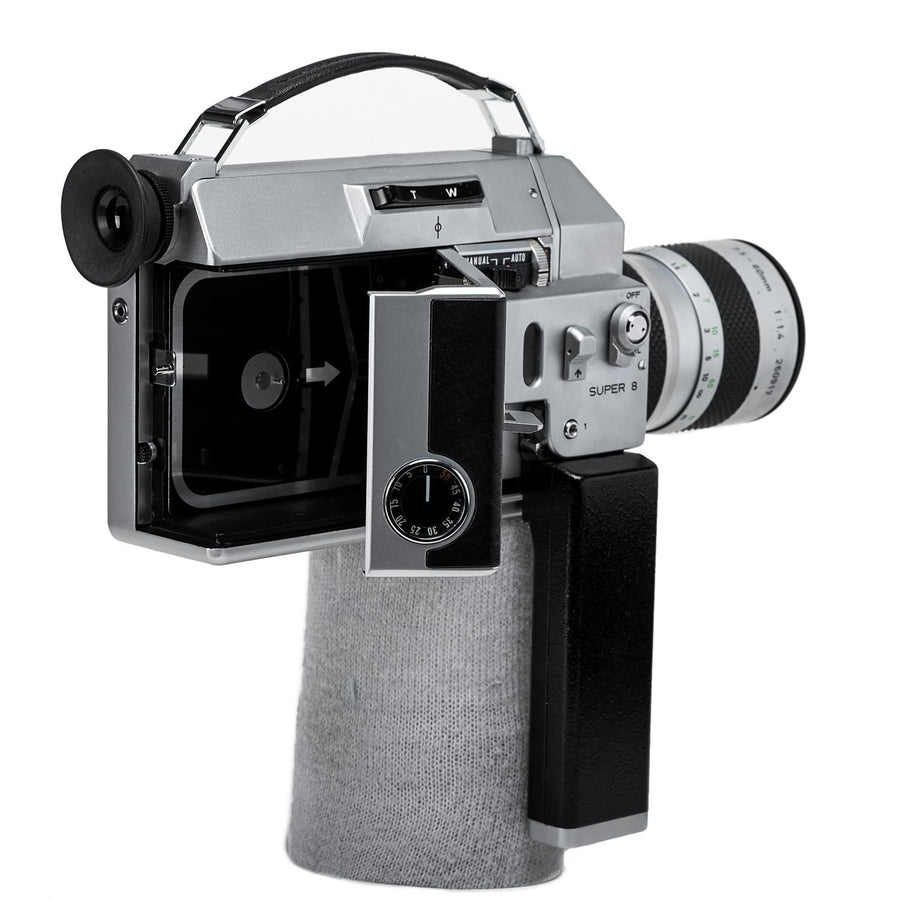 Canon Super 8mm film camera sits on a tripod. Canon 814 auto zoom Stock Photo Canon Super 8mm film camera sits on a tripod. Canon 814 auto zoom Stock Photo